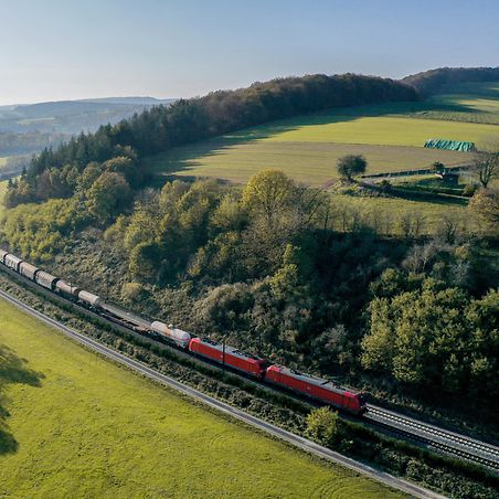 Freight train in a green landscape