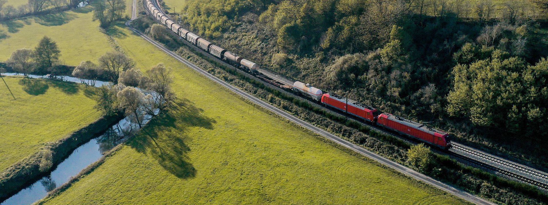 Freight train in a green landscape